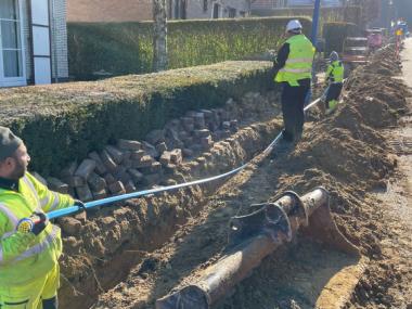 Piet den Ouden on-site with manhole in the background